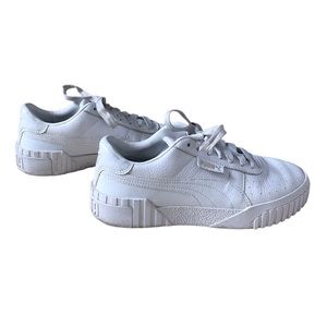 All white Puma Carina Leather Sneakers
